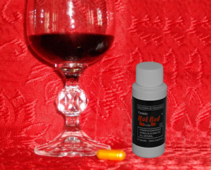 A glass of wine and a bottle on the table A glass of wine and a bottle on the table